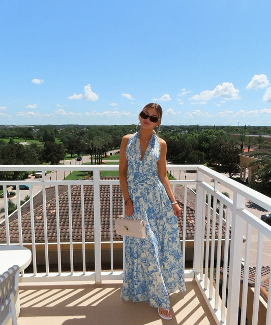 Model in the Isabella blue floral maxi dress, a floor-length summer wedding guest look in South Florida